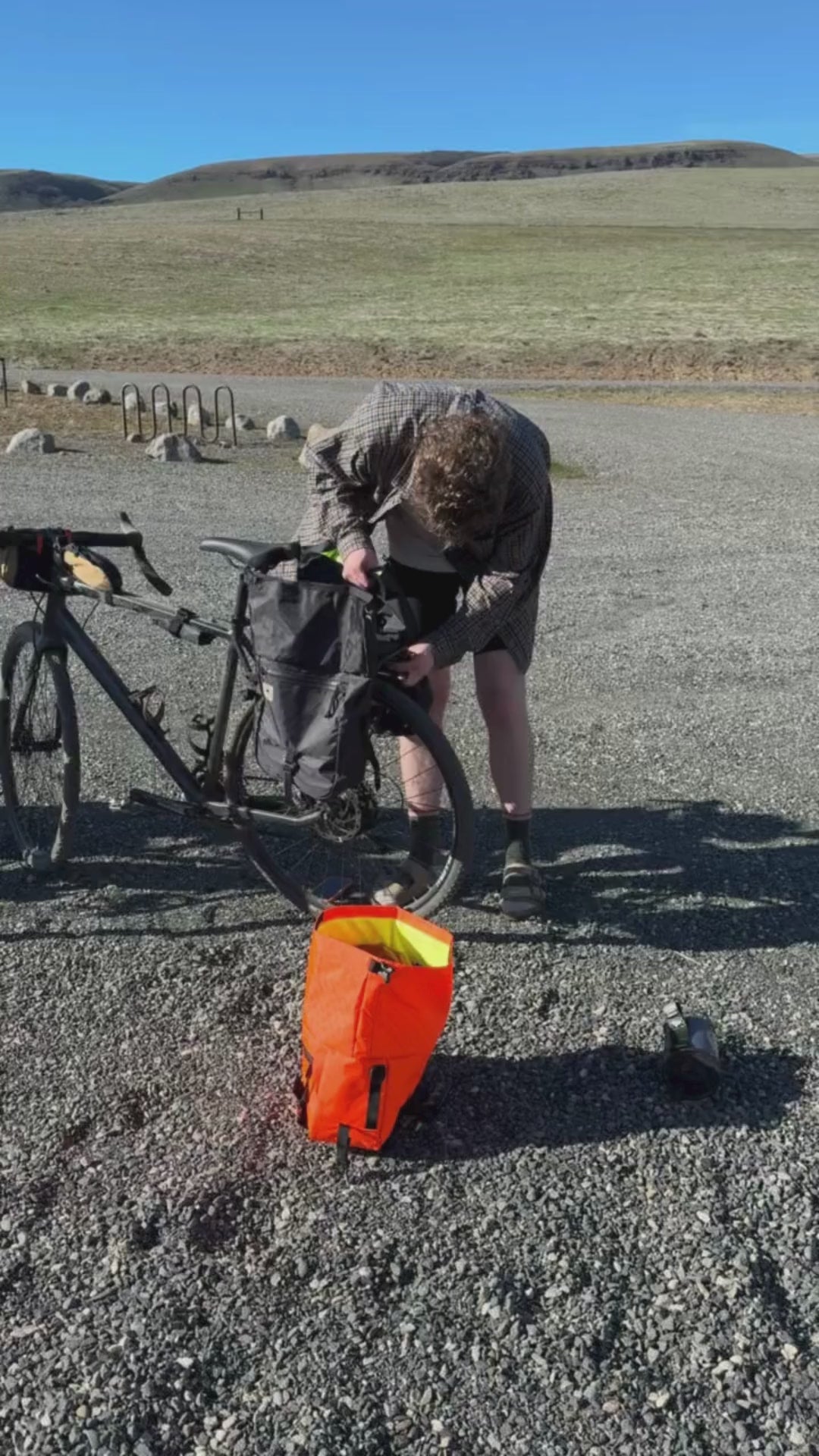 Bikepacking 澳洲5结果记录 adventure showing 2 cyclists loading bags for a gravel ride.