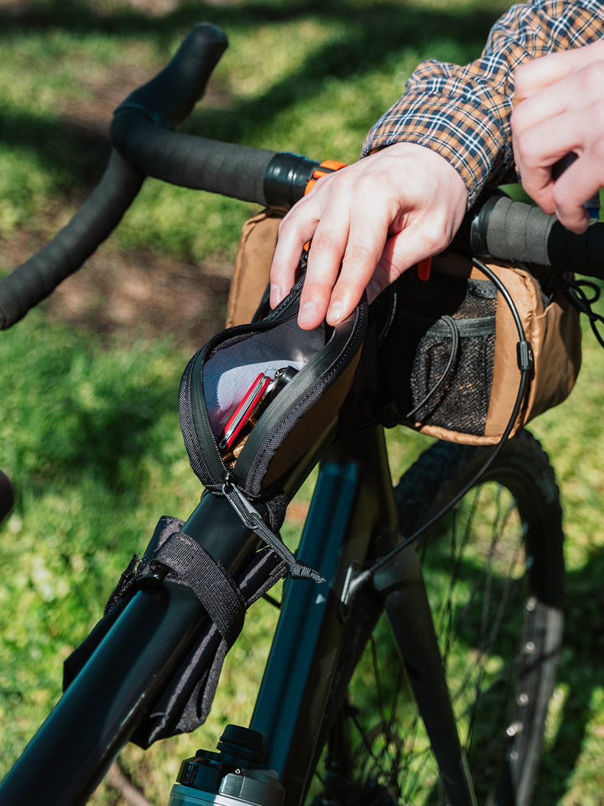 Detail view of Fuel Pouch mounted to bicycle with items inside.  - North St Bags all-groups