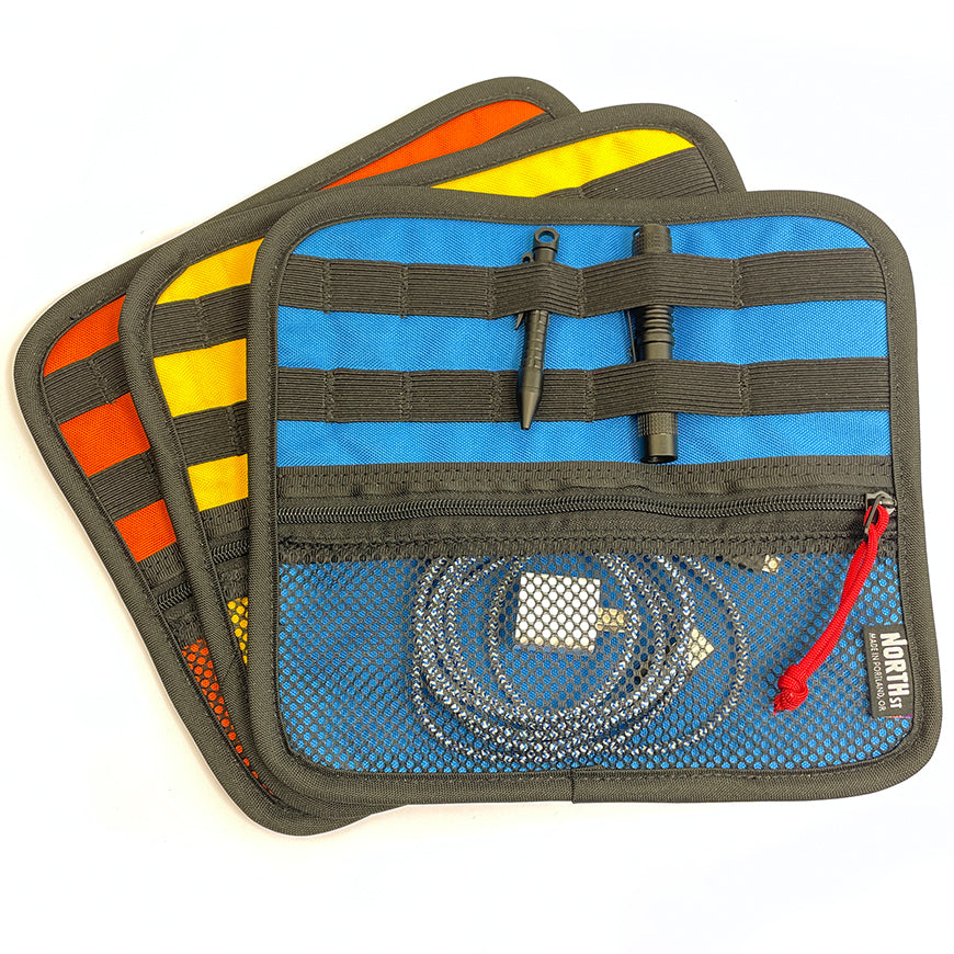 Array of 3 EDC orgainzers in blue, yellow and orange showing items loaded into pocket and elastic slots.  - North St Bags