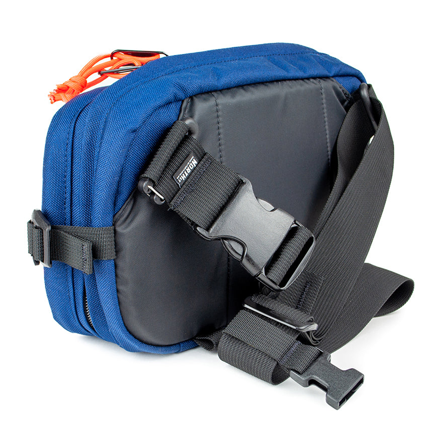 detail view of sling pack by North St showing back and strap