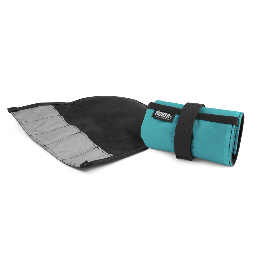 North St tool in teal roll shown open and flat next to one rolled up